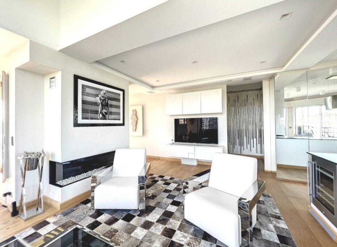 Lounge with designer gas fireplace at the Eiffel View Penthouse