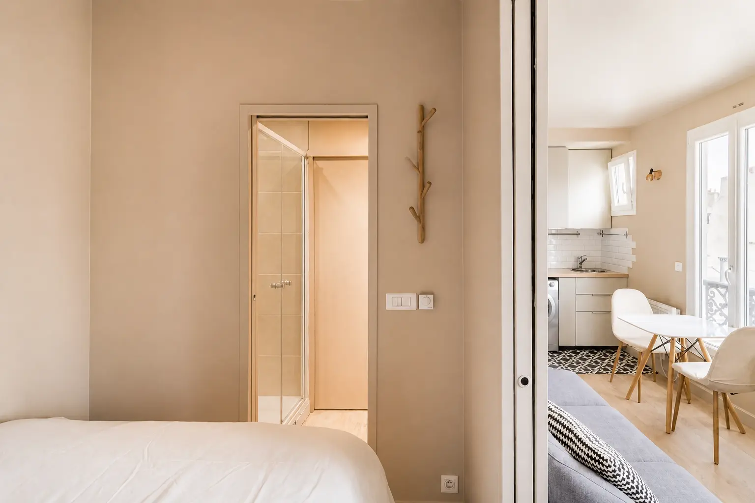 View from the sleeping area towards the living space and bathroom — Rue Amélie, 7e arrondissement de Paris, Paris