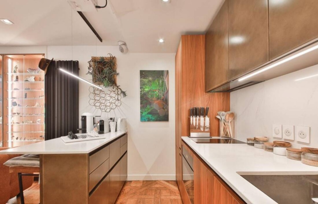 Designer Boffi kitchen with induction hob, walnut cabinetry and stone worktops