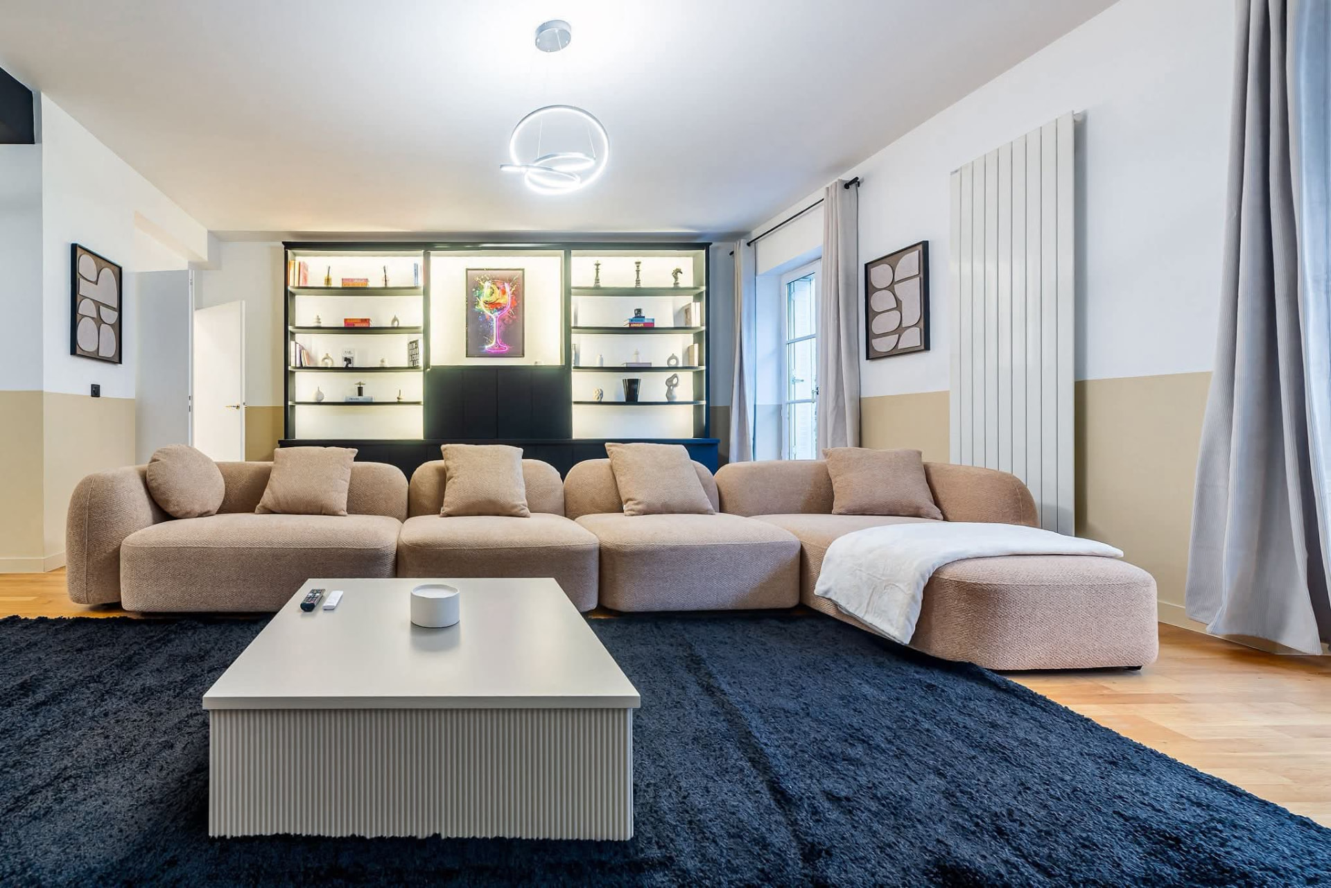 Large living room with sectional sofa and contemporary lighting — Paris 7e, Paris, France
