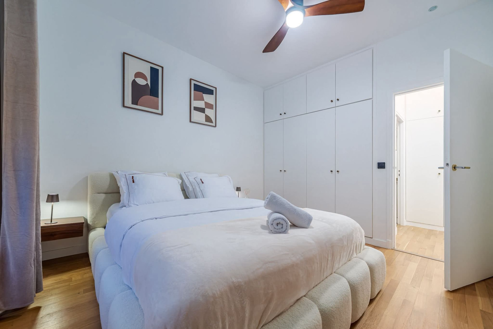 Principal bedroom with double bed, fitted wardrobes and ceiling fan — Paris 7e, Paris, France