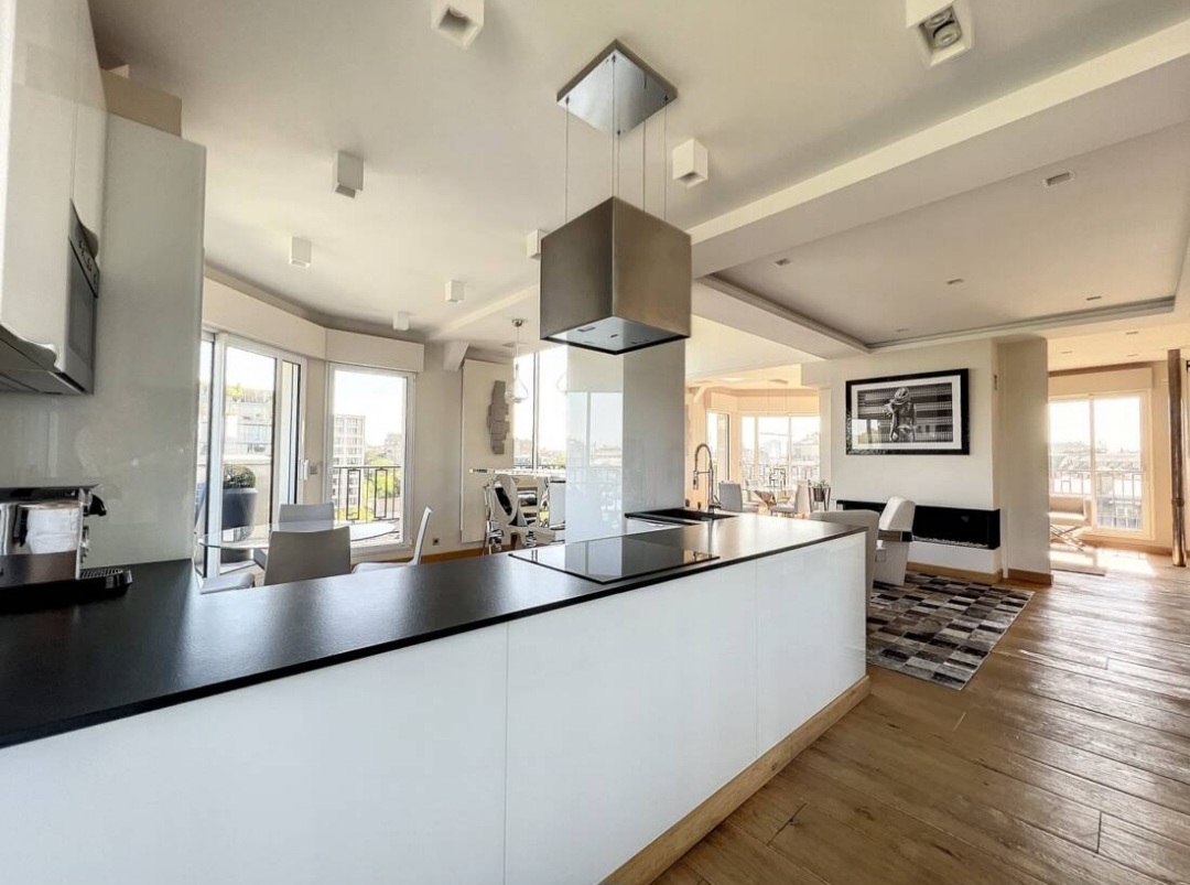 Fully equipped designer kitchen with island and induction hob