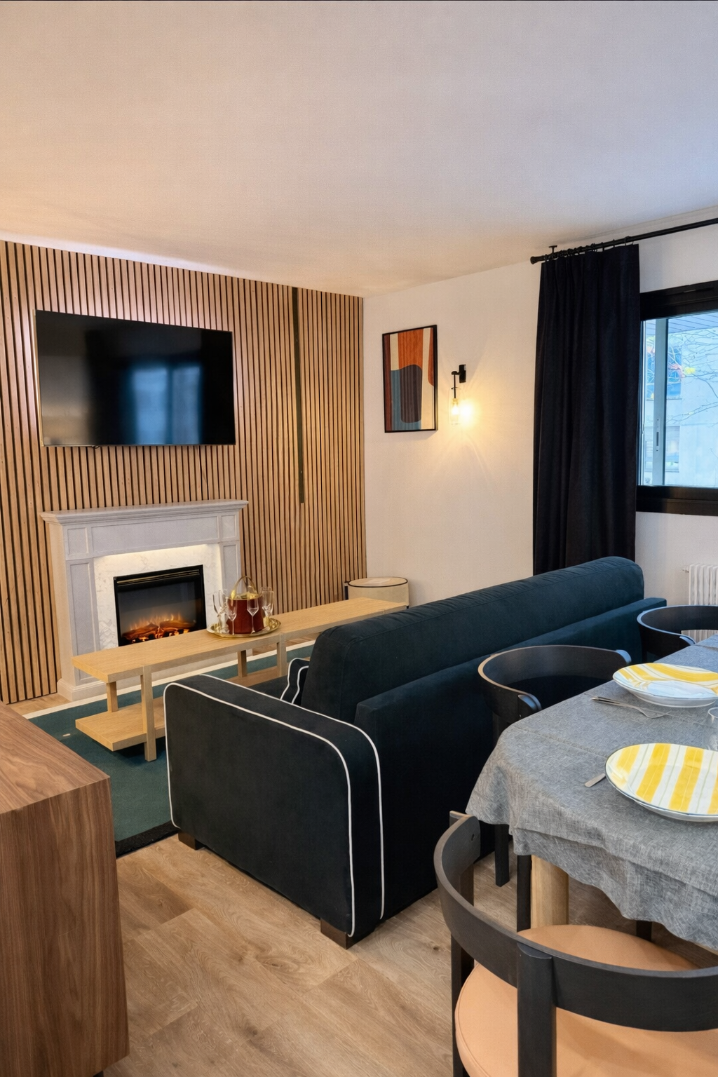 Living room with velvet sofa, dining area and contemporary lighting — Paris 16th · Auteuil, Paris, France